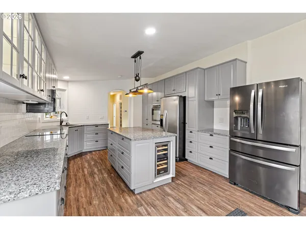 a kitchen with cabinets and stainless steel appliances