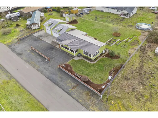 an aerial view of a house with a garden