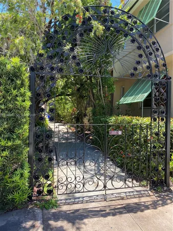 a view of bushes and pathway