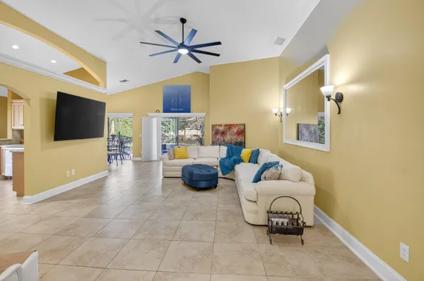 a view of a livingroom with furniture and a window