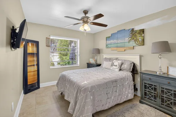 a lobby with furniture and floor to ceiling window