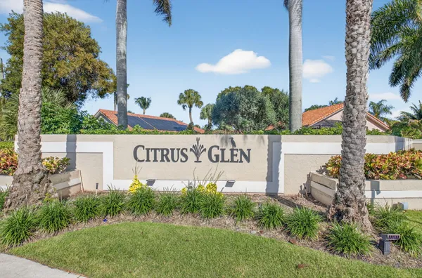 a view of a swimming pool with a yard