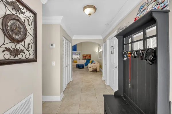 a kitchen with a sink cabinets and wooden floor