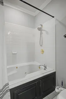 a bathroom with a bathtub and a sink