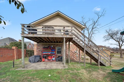 a view of a car is parked in front of a house