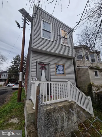 a kitchen with a sink refrigerator and cabinets