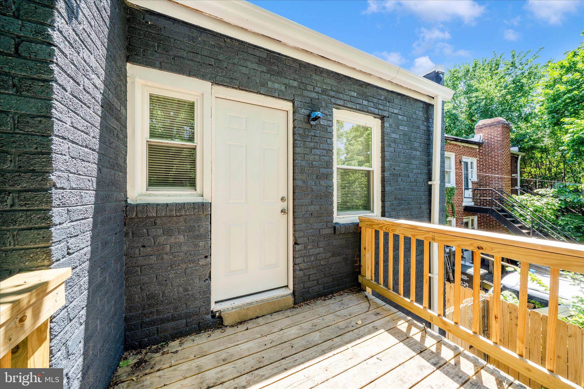5027 Benning Road Southeast Washington, DC 20019 - Photo 49 of 57 a view of a brick house with a large window