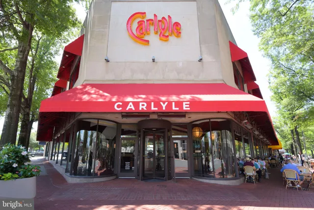 an outdoor cafe with a table and chairs