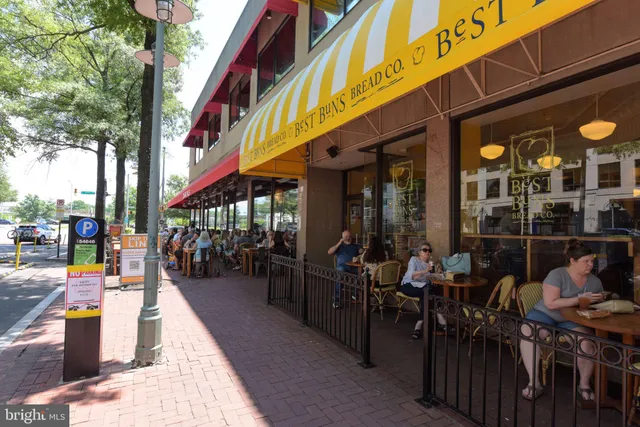 a view of the patio with a table and chairs under an umbrella