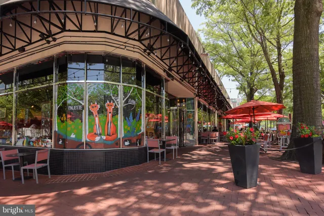 a view of a building with car parked