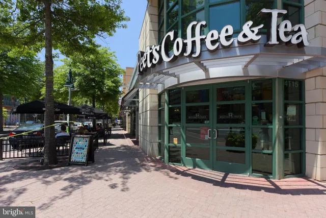 a view of a building with a yard