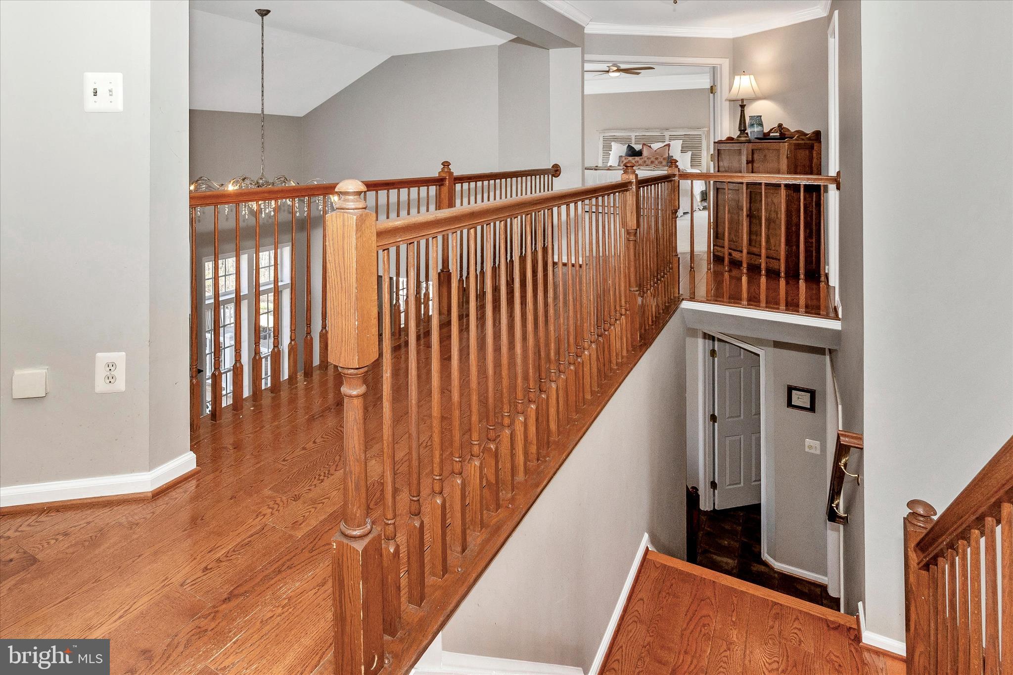 6243 Woodville Road Mount Airy, MD 21771 - Photo 18 of 50 a view of a hallway with wooden floor and staircase
