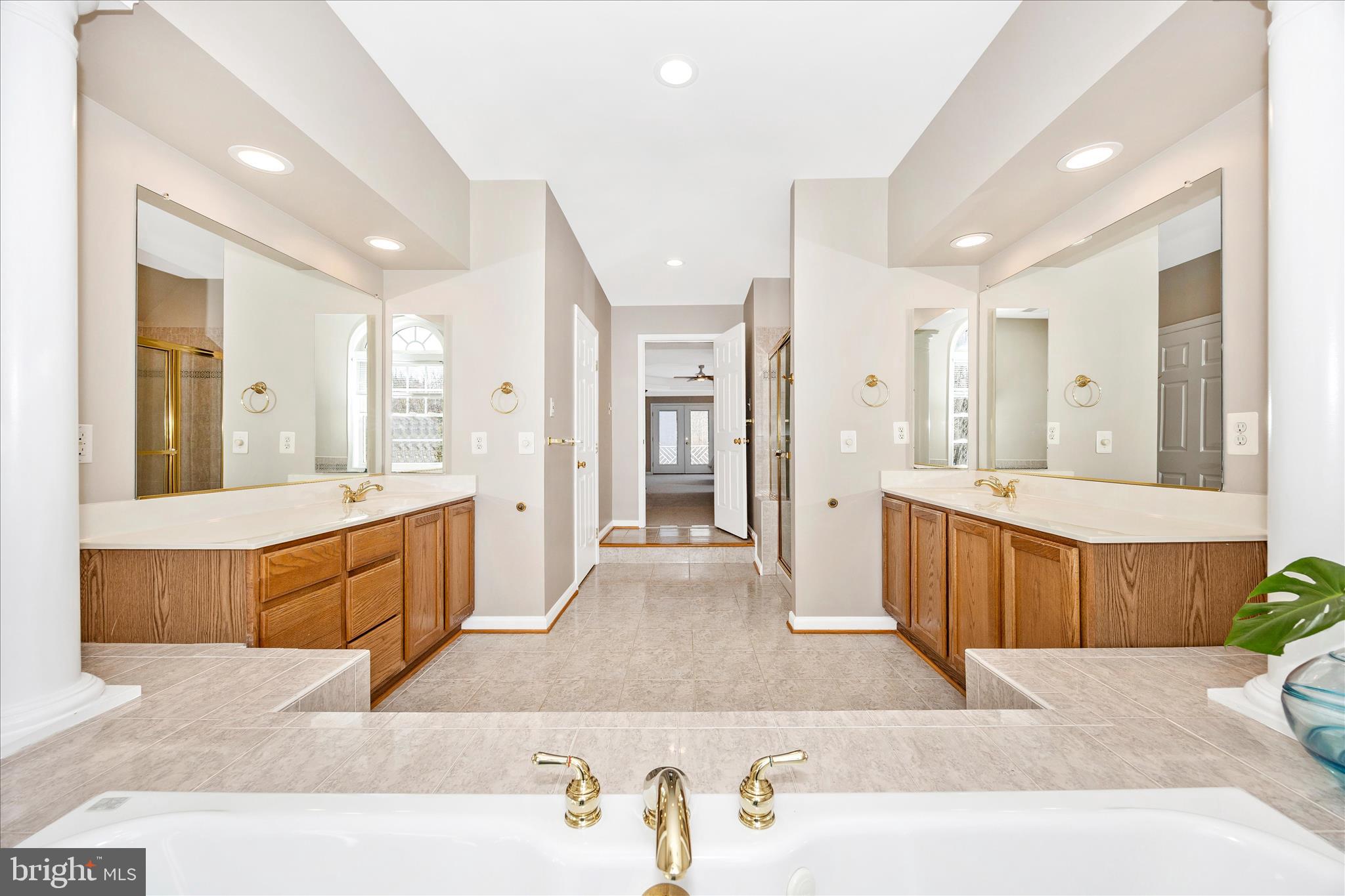 6243 Woodville Road Mount Airy, MD 21771 - Photo 24 of 50 a large bathroom with a large tub shower and sink