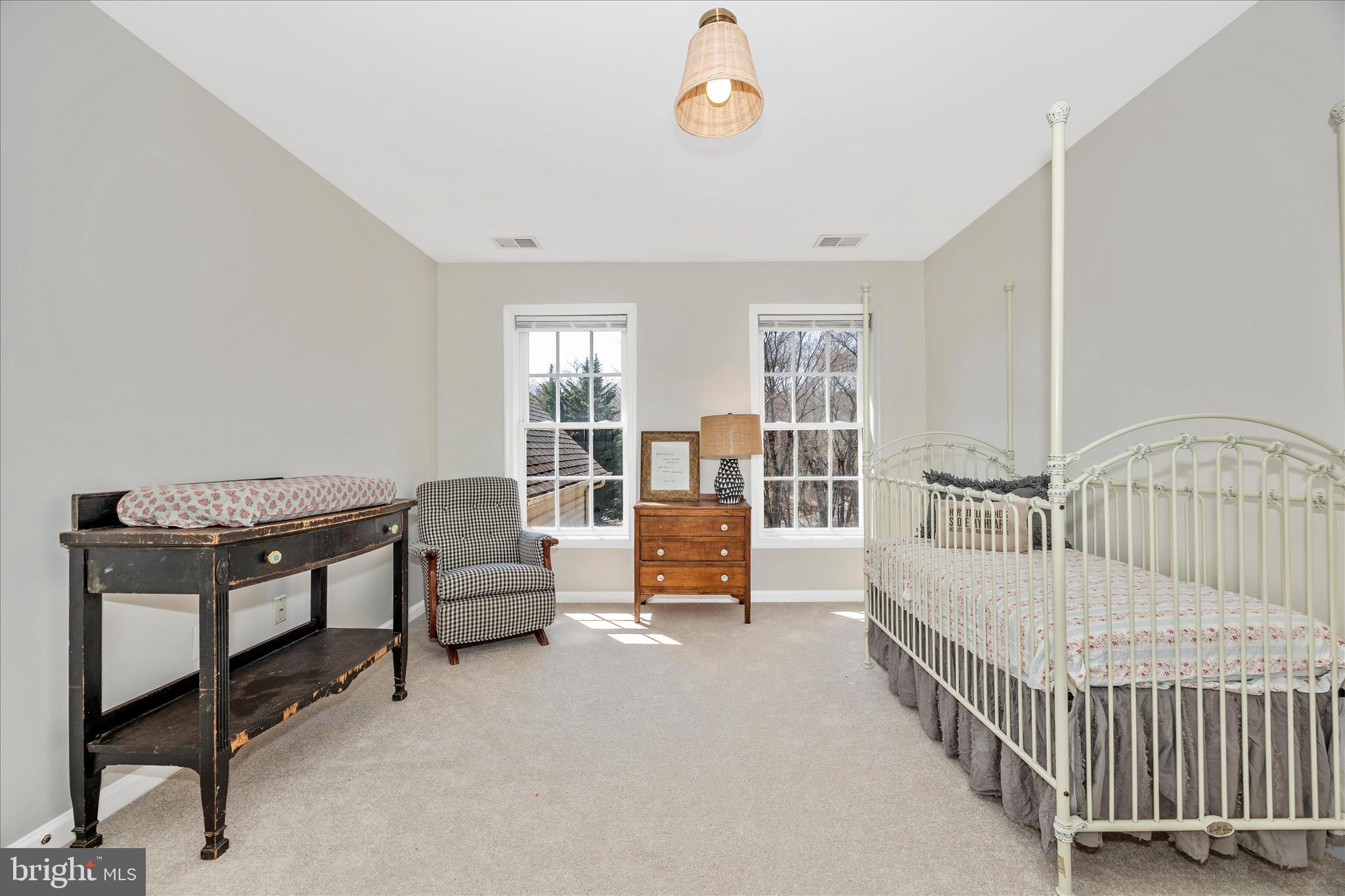 6243 Woodville Road Mount Airy, MD 21771 - Photo 28 of 50 a bedroom with furniture and a window