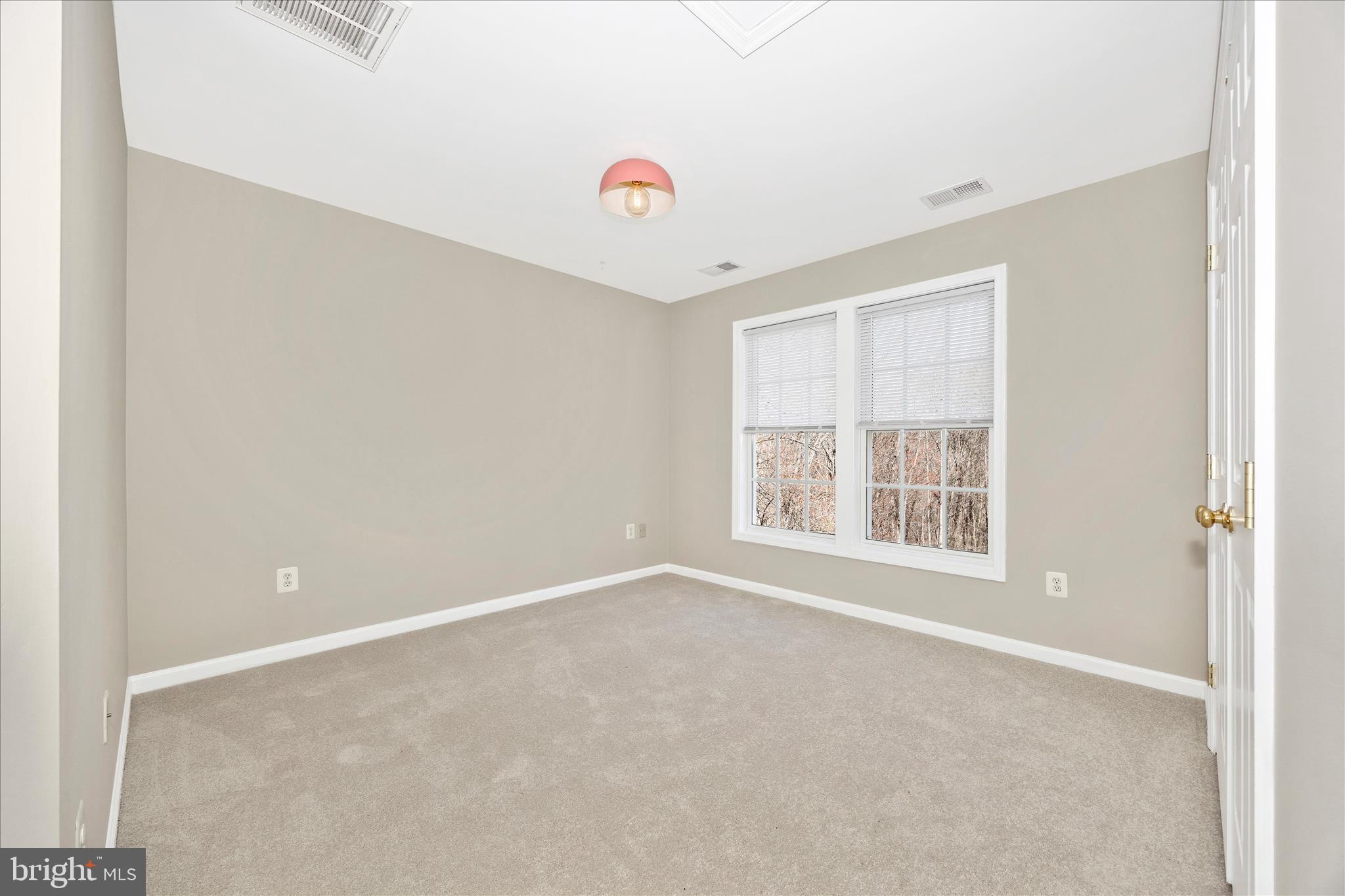 6243 Woodville Road Mount Airy, MD 21771 - Photo 30 of 50 a view of an empty room with a window