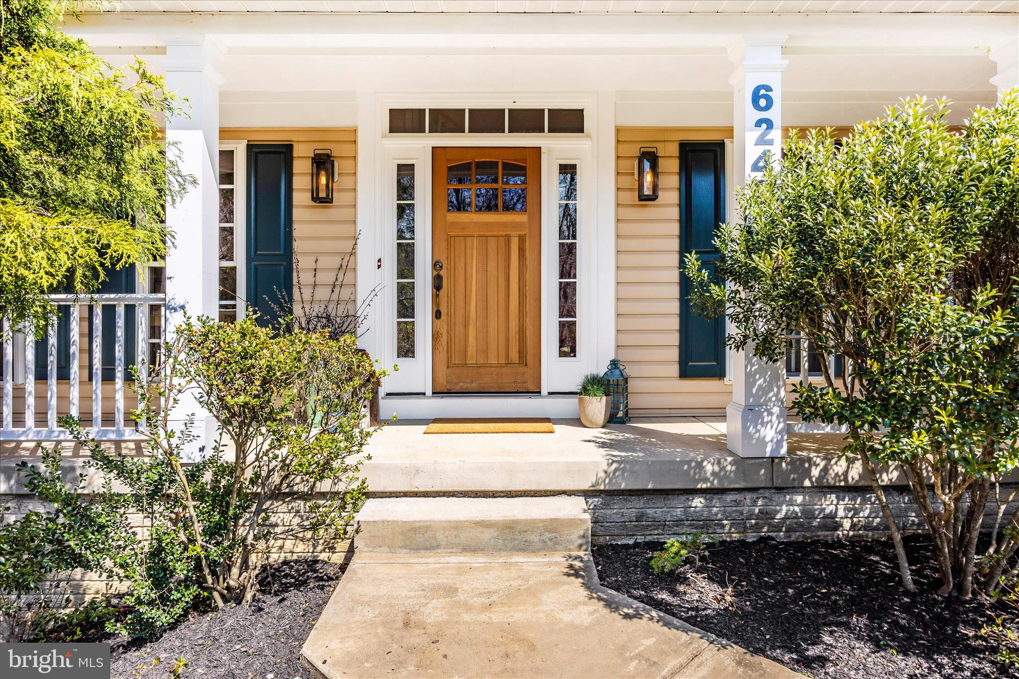 6243 Woodville Road Mount Airy, MD 21771 - Photo 3 of 50 a front view of a house with a garden