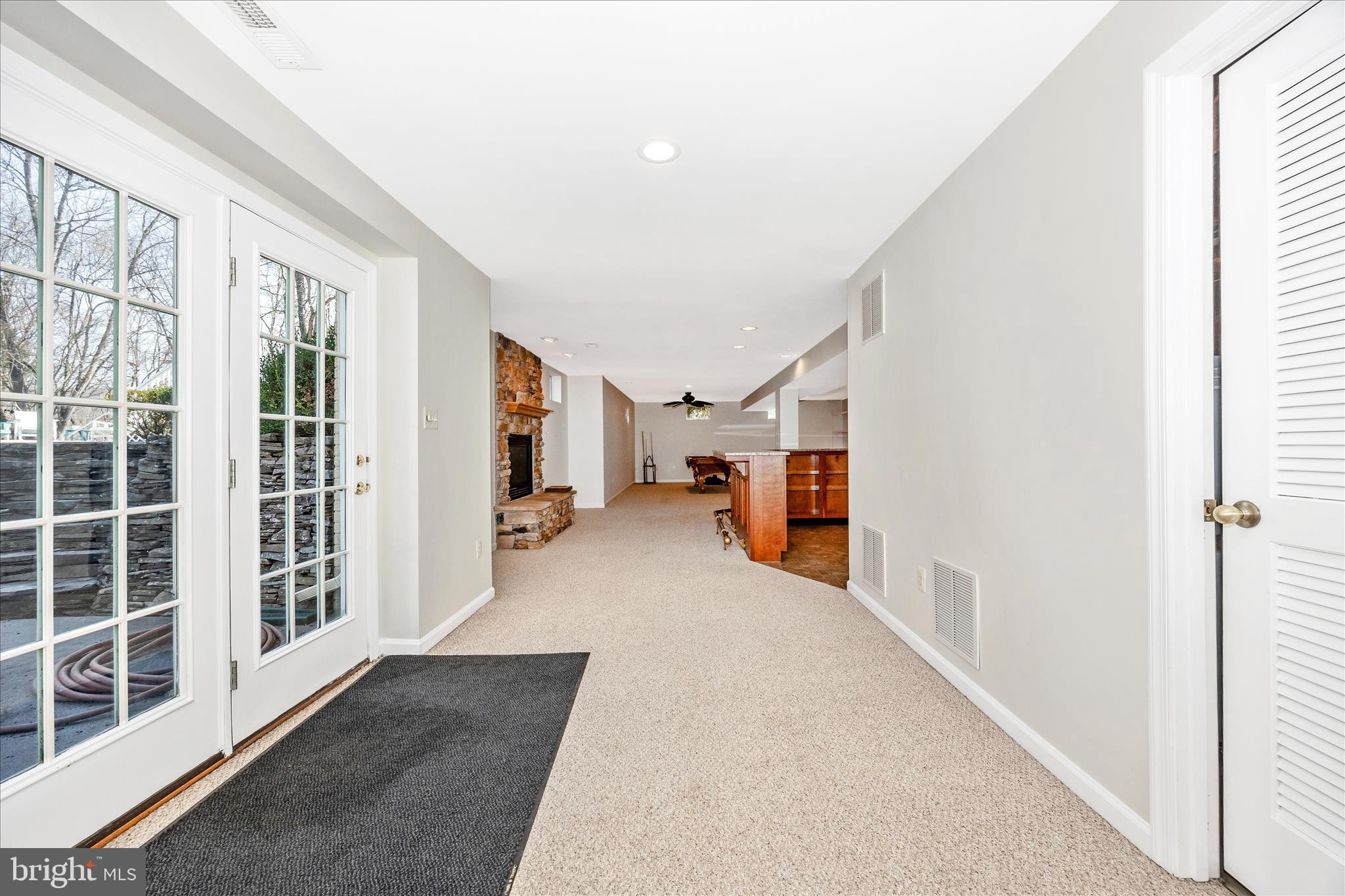 6243 Woodville Road Mount Airy, MD 21771 - Photo 34 of 50 a view of a hallway with wooden floor and windows