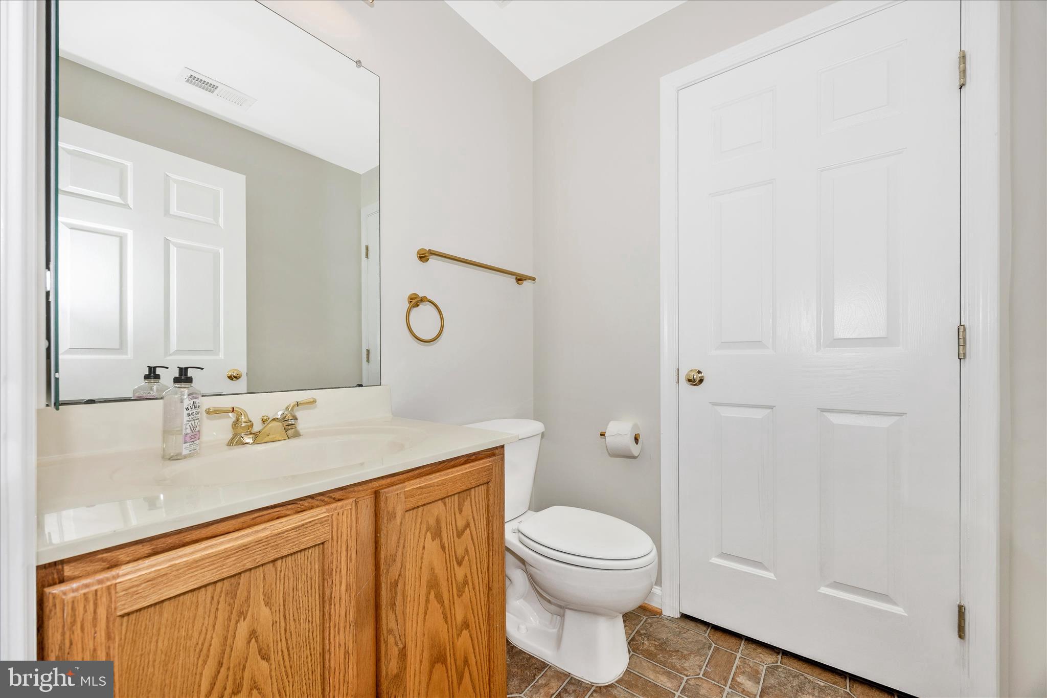 6243 Woodville Road Mount Airy, MD 21771 - Photo 36 of 50 a bathroom with a sink a toilet and shower