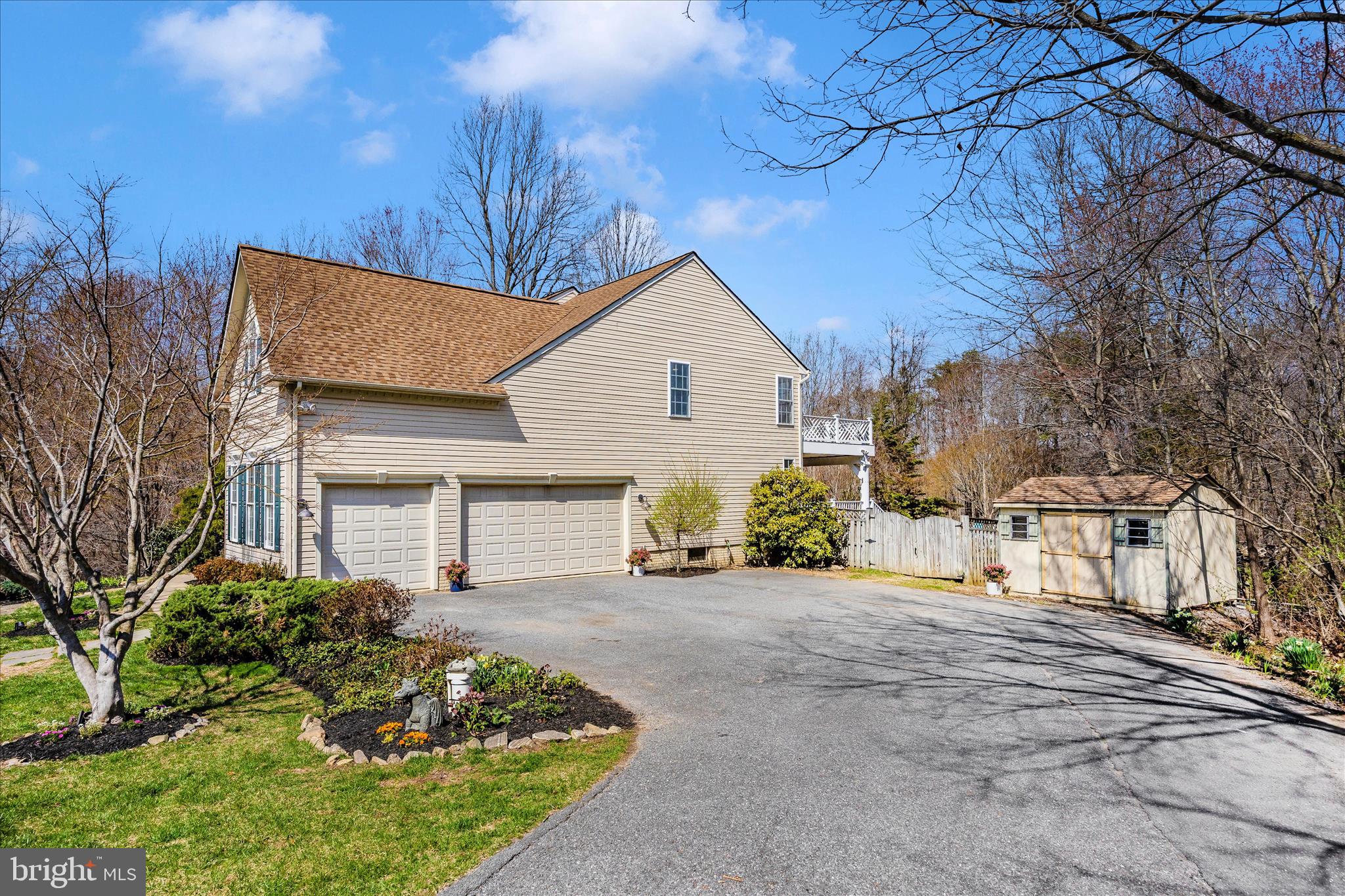 6243 Woodville Road Mount Airy, MD 21771 - Photo 49 of 50 a front view of a house with a garden