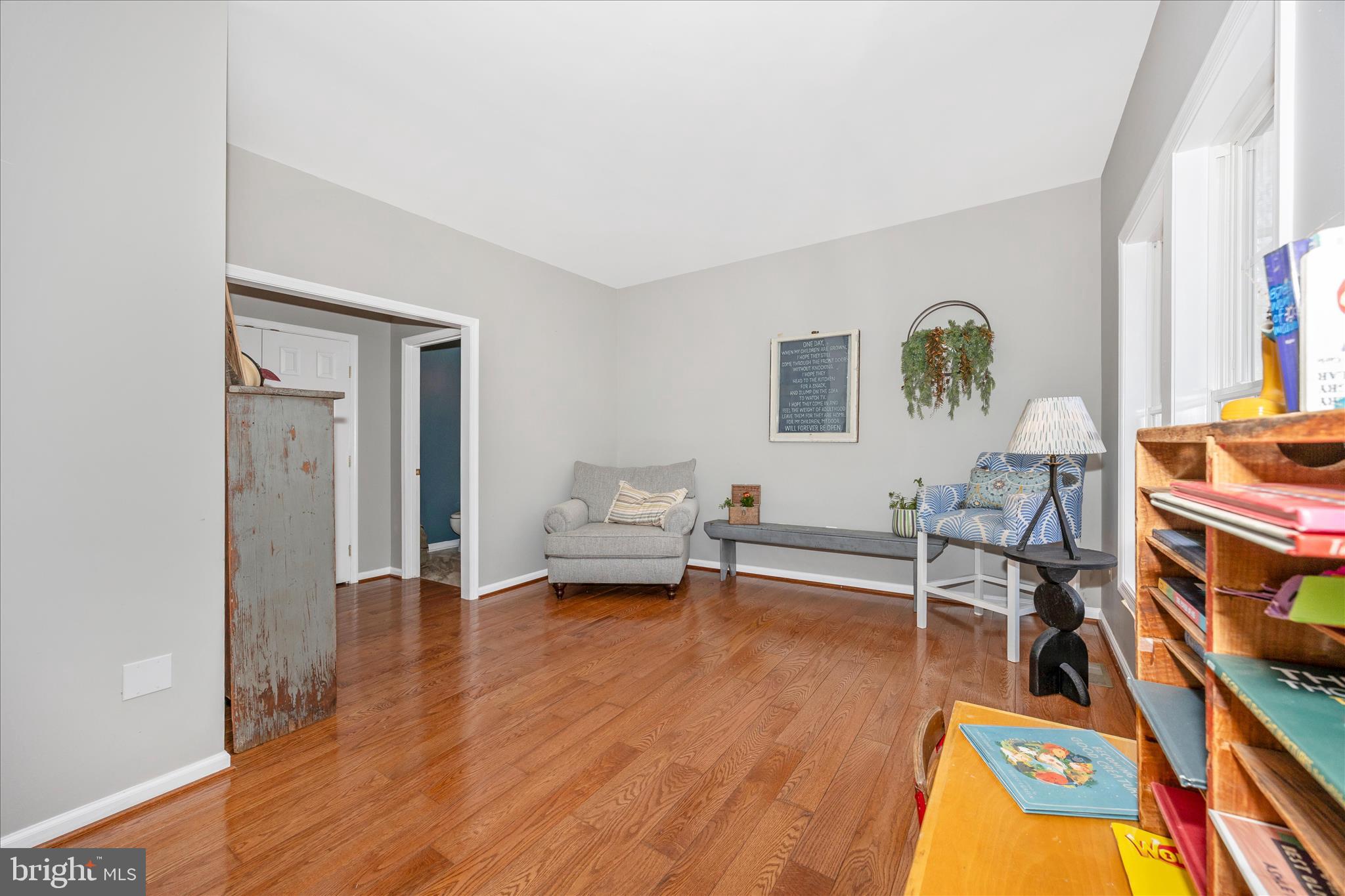 6243 Woodville Road Mount Airy, MD 21771 - Photo 6 of 50 a living room with furniture and a wooden floor