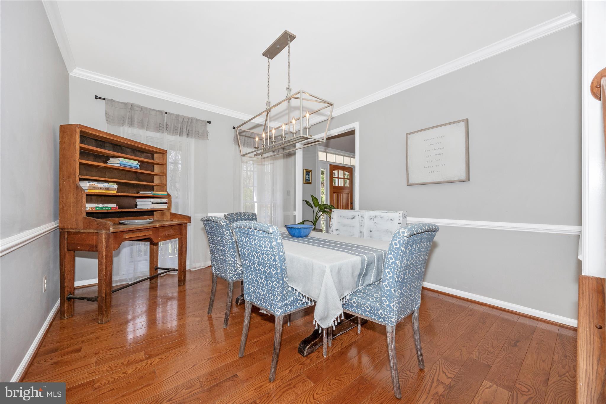 6243 Woodville Road Mount Airy, MD 21771 - Photo 7 of 50 a view of a dining room with furniture a chandelier and wooden floor