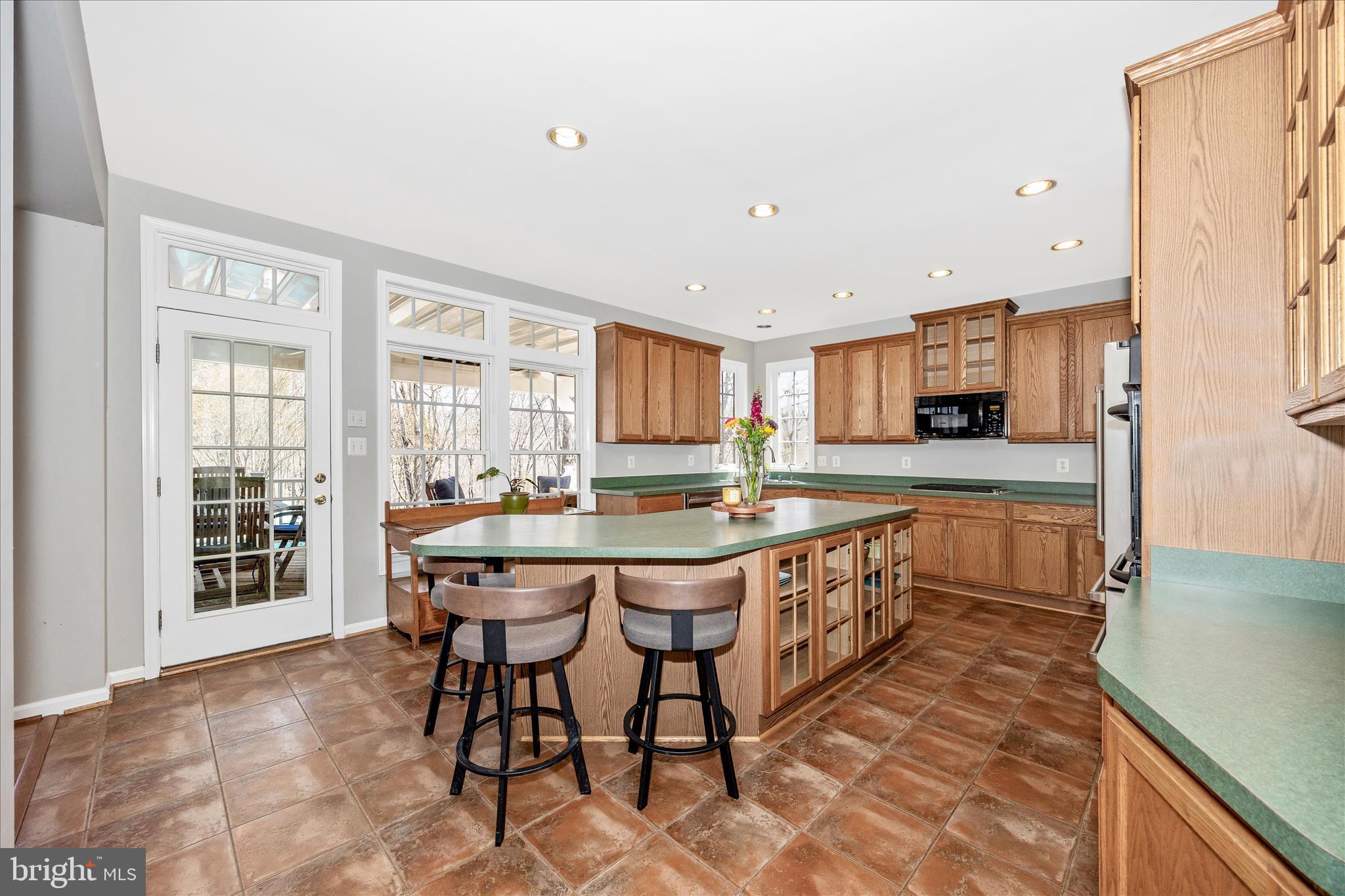 6243 Woodville Road Mount Airy, MD 21771 - Photo 8 of 50 a kitchen with stainless steel appliances granite countertop a sink and a refrigerator
