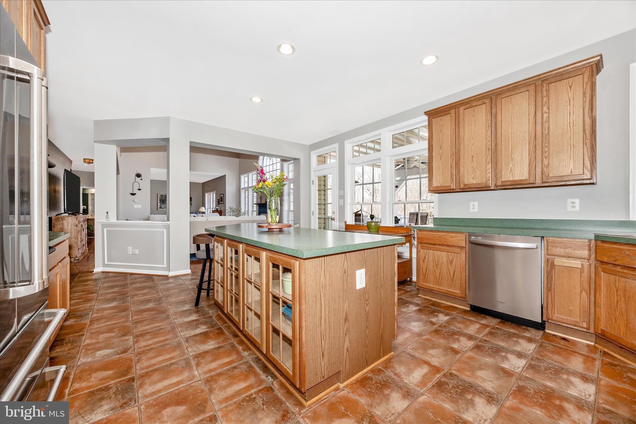 6243 Woodville Road Mount Airy, MD 21771 - Photo 9 of 50 a kitchen with stainless steel appliances granite countertop a stove a sink and a refrigerator