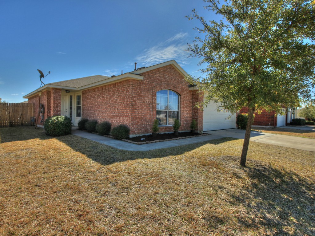 2209 Pearson Way Round Rock, TX 78665 - Photo 1 of 1 a front view of a house with garden
