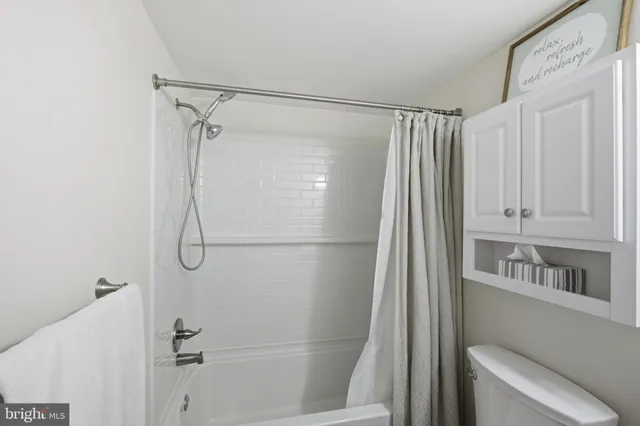 a bathroom with a shower and a tub