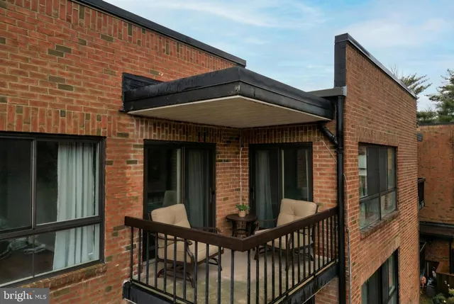 a view of a brick house with a large window