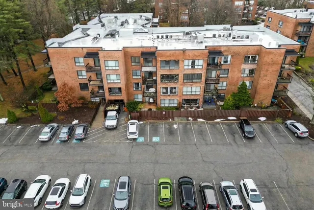 a view of a patio with table and chairs potted plants