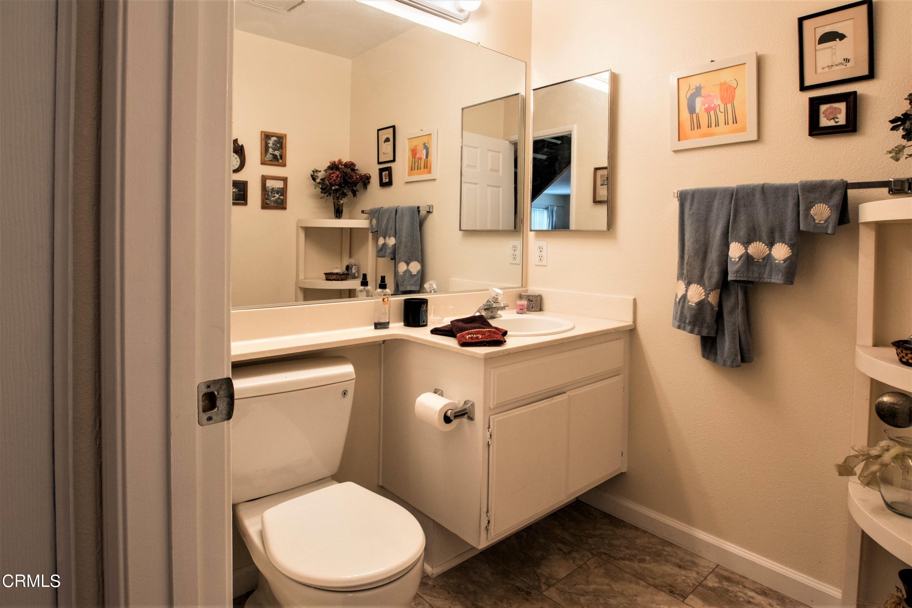 456 West Wooley Road Oxnard, CA 93030 - Photo 11 of 17 a bathroom with a sink a toilet and a mirror