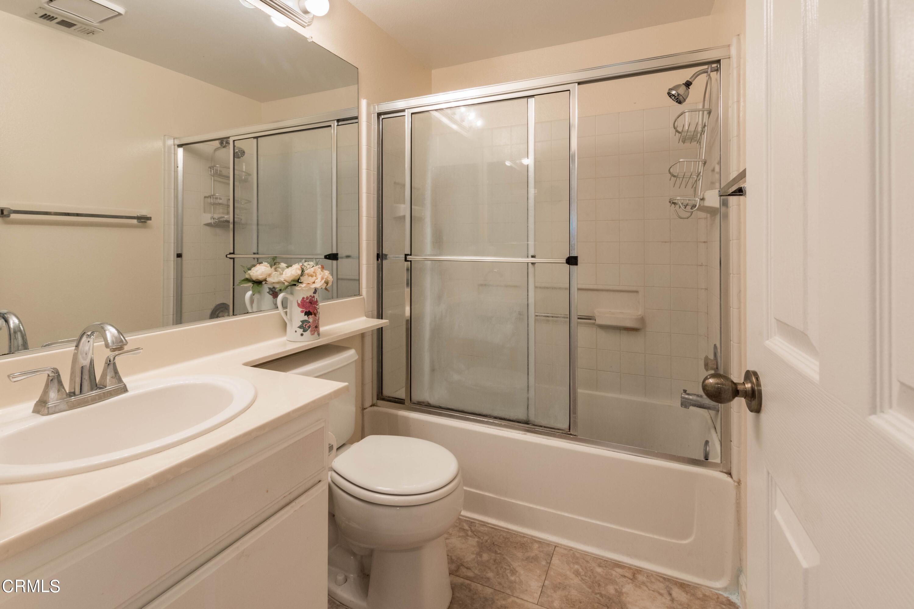 456 West Wooley Road Oxnard, CA 93030 - Photo 13 of 17 a bathroom with a toilet a sink and shower