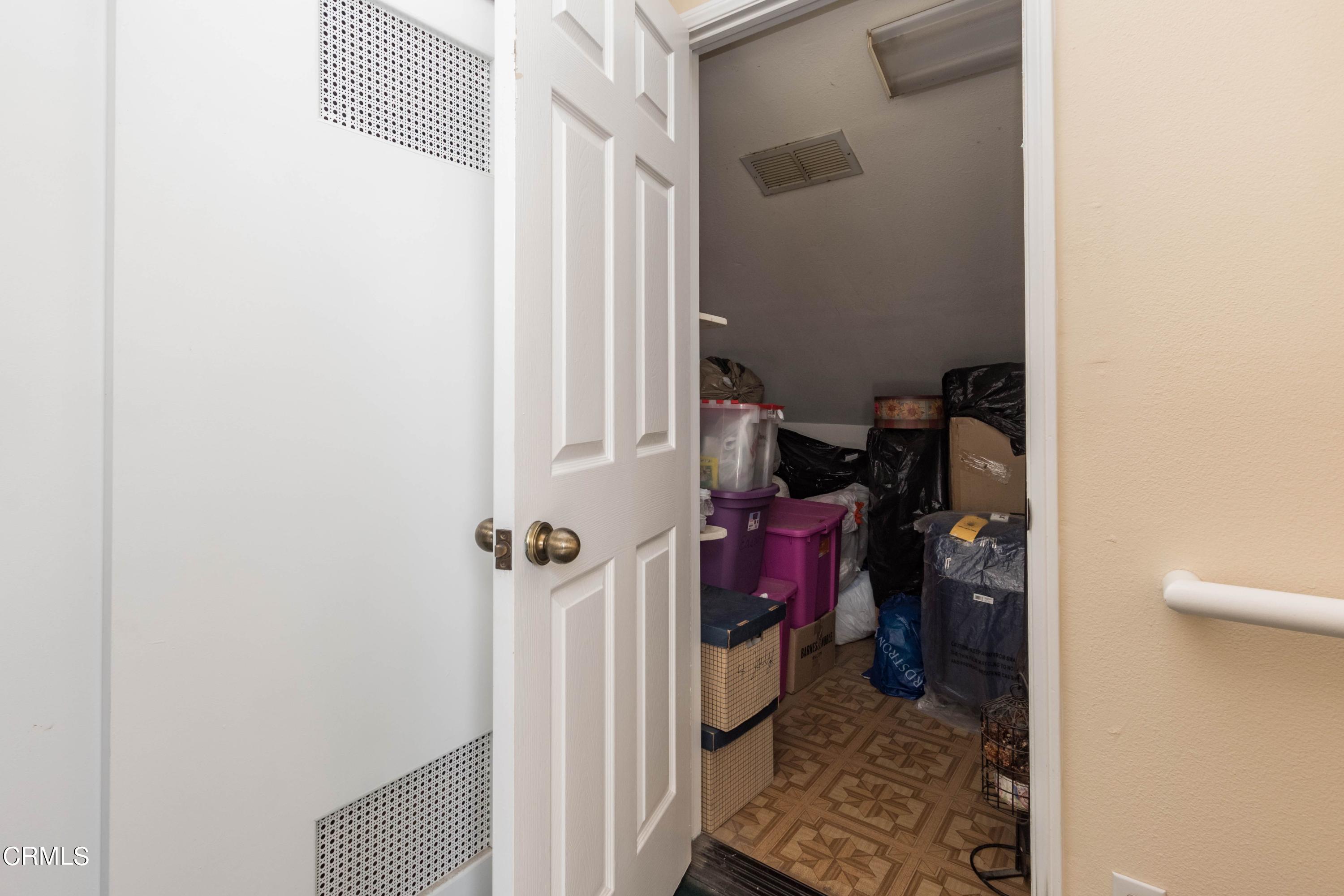 456 West Wooley Road Oxnard, CA 93030 - Photo 15 of 17 a view of a hallway with closet and a utility room
