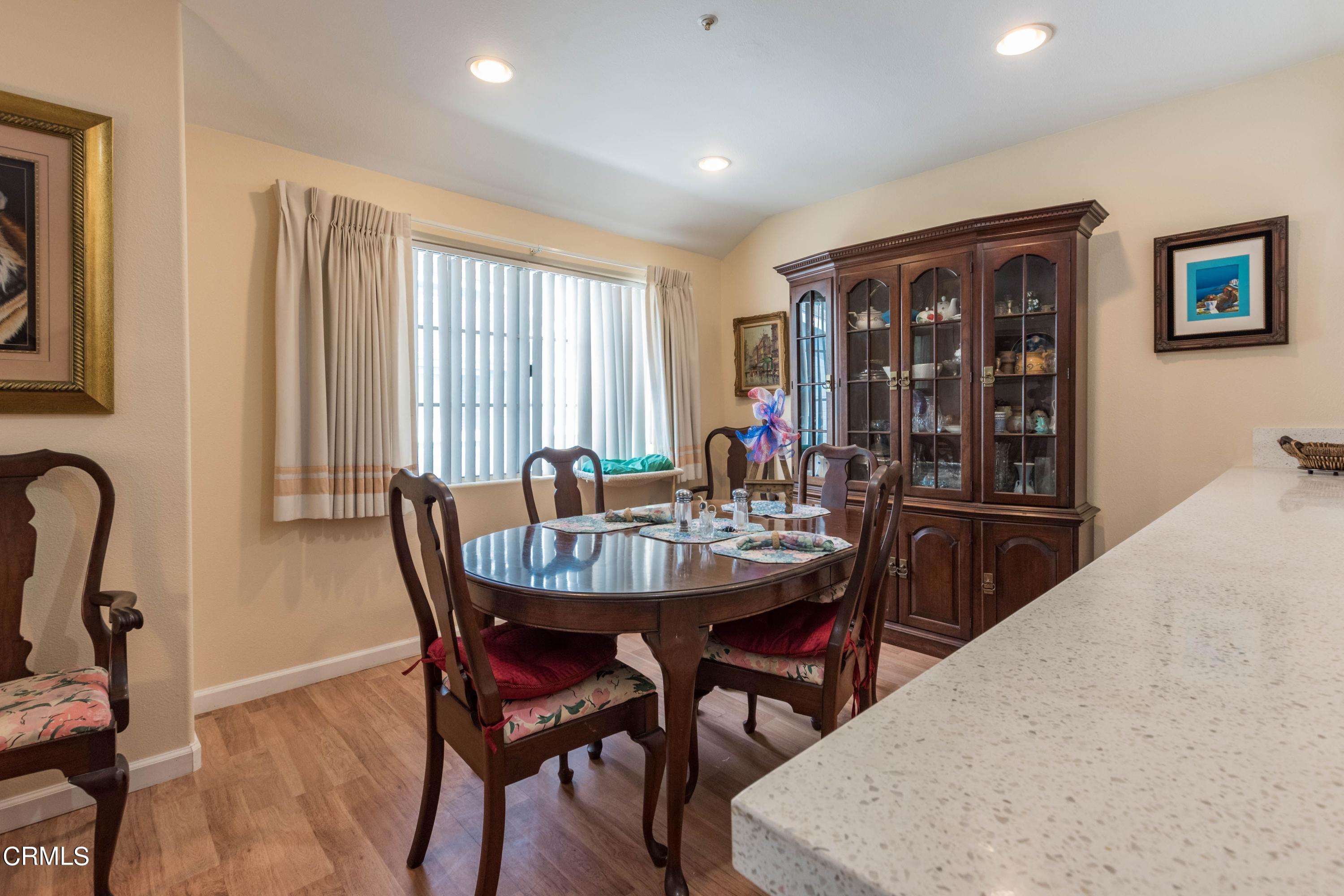456 West Wooley Road Oxnard, CA 93030 - Photo 3 of 17 a view of a a dining room with furniture window and wooden floor