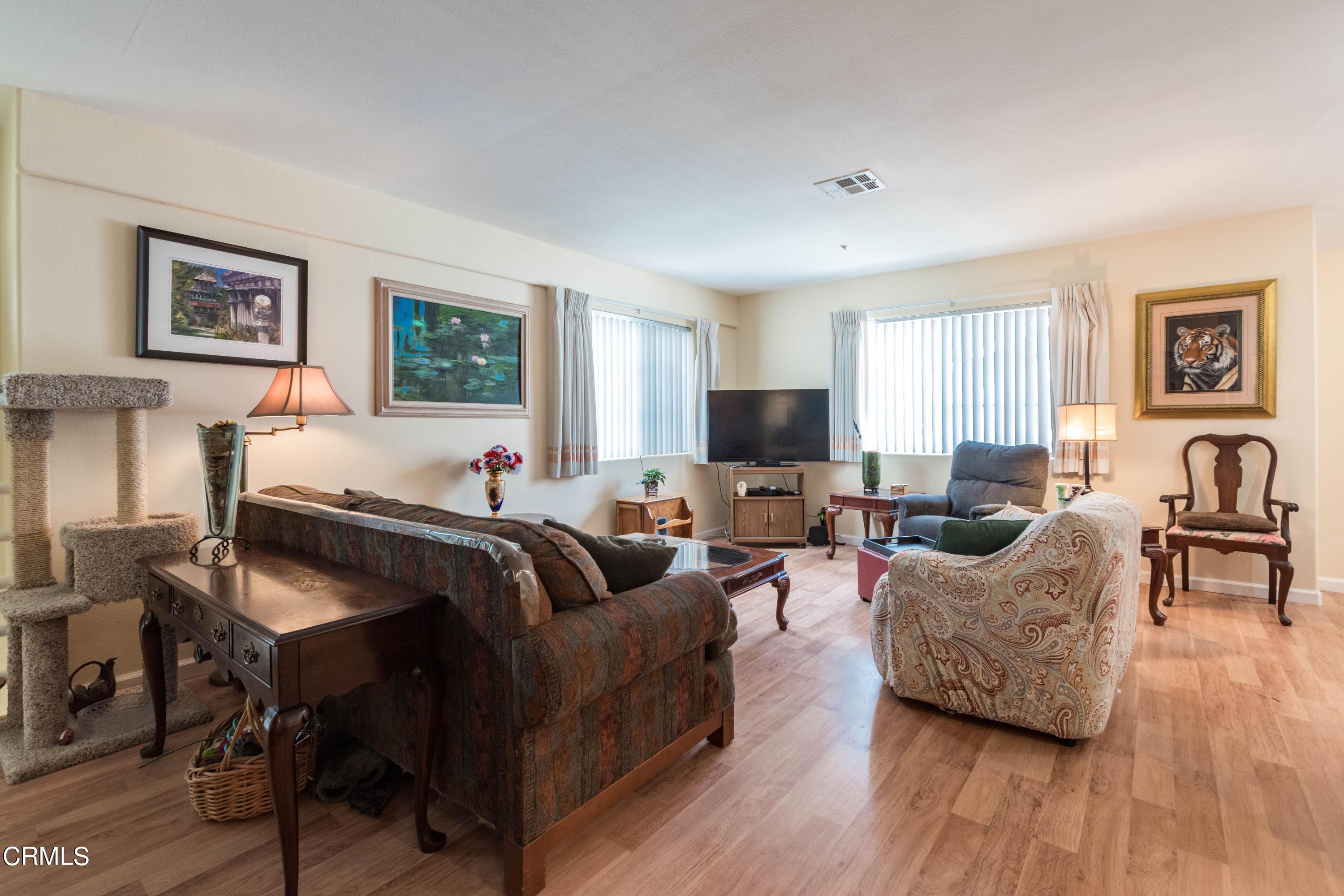 456 West Wooley Road Oxnard, CA 93030 - Photo 4 of 17 a living room with furniture and a flat screen tv