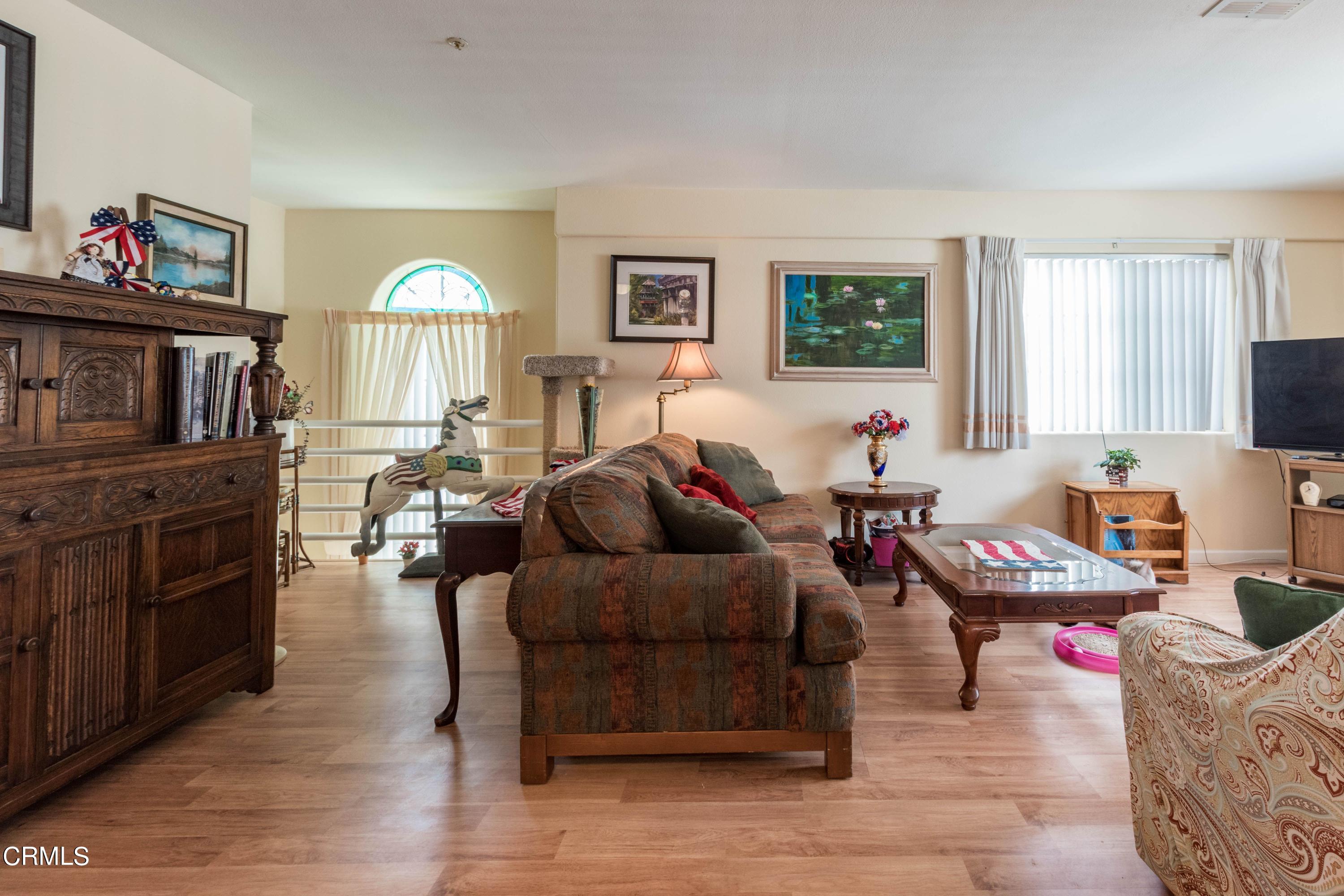 456 West Wooley Road Oxnard, CA 93030 - Photo 5 of 17 a living room with furniture and a flat screen tv