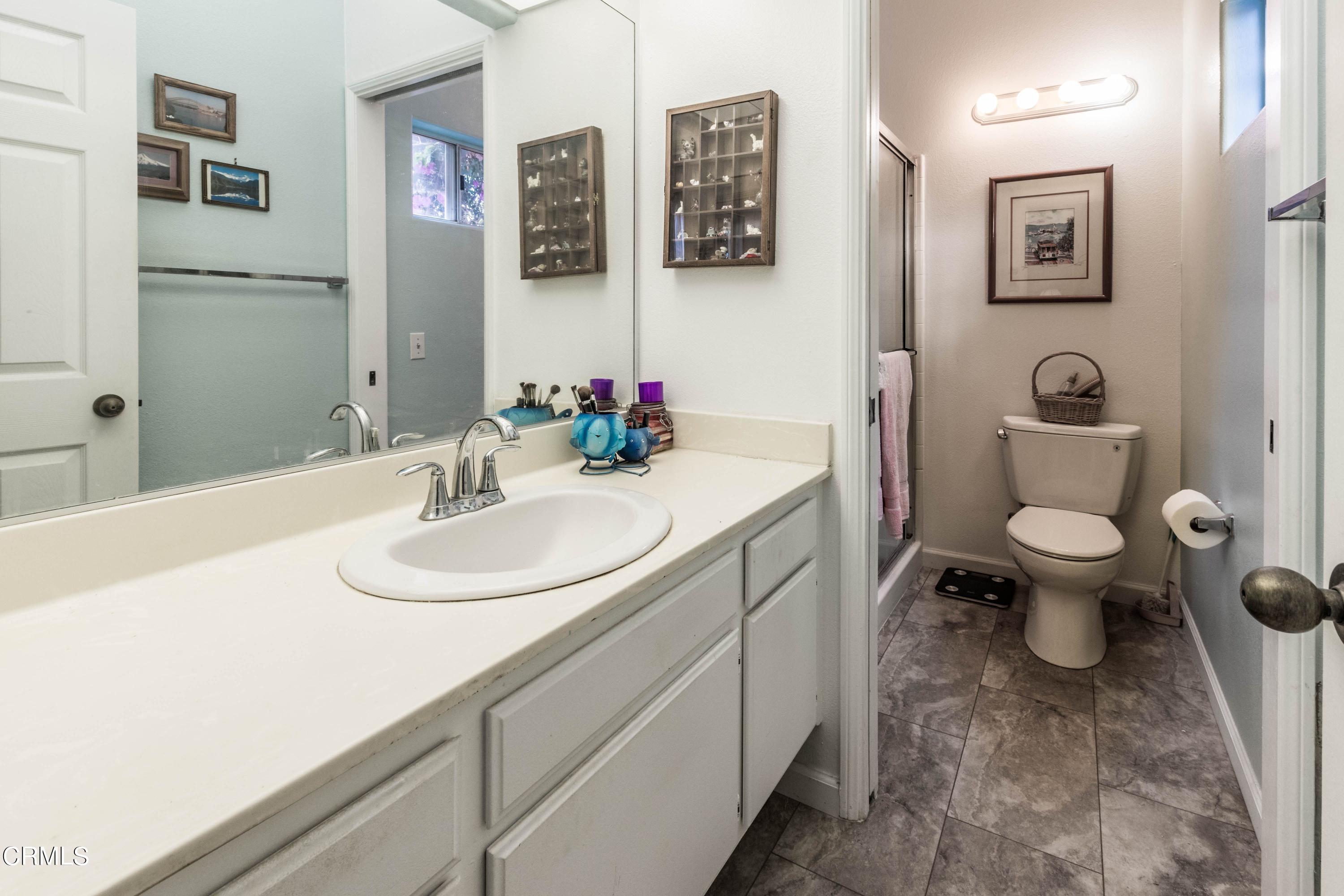 456 West Wooley Road Oxnard, CA 93030 - Photo 7 of 17 a bathroom with a sink and a mirror