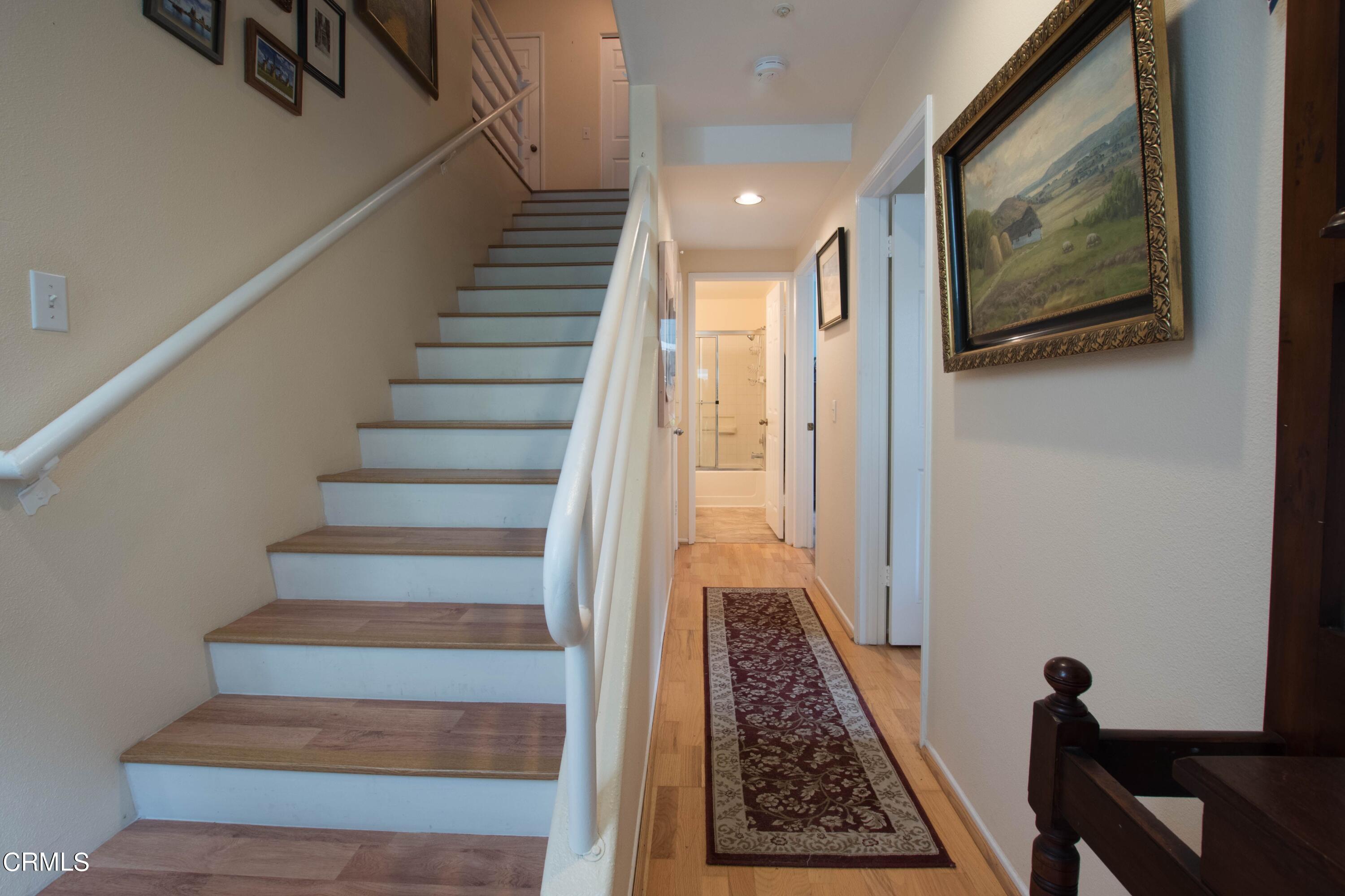 456 West Wooley Road Oxnard, CA 93030 - Photo 9 of 17 a view of staircase with black and white walls