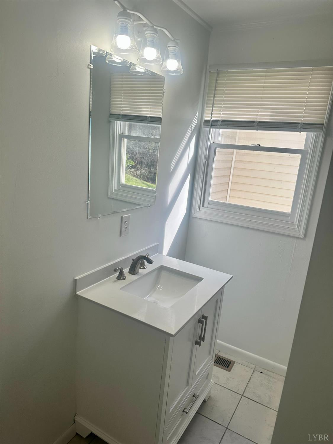 476 Kenmore Road Amherst, VA 24521 - Photo 16 of 32 a bathroom with a sink vanity and a mirror