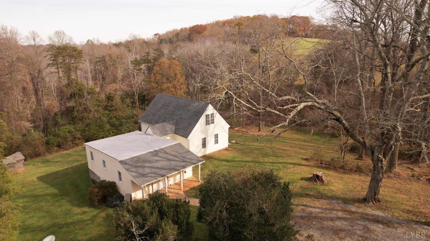 476 Kenmore Road Amherst, VA 24521 - Photo 2 of 32 a view of a house with a yard and mountain