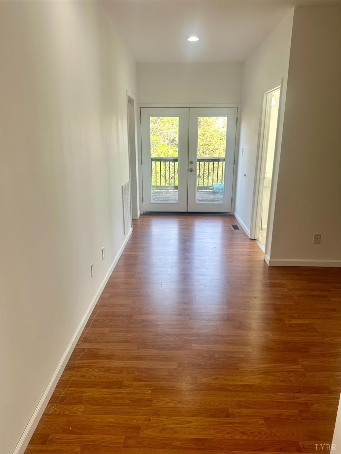 476 Kenmore Road Amherst, VA 24521 - Photo 23 of 32 an empty room with wooden floor and windows