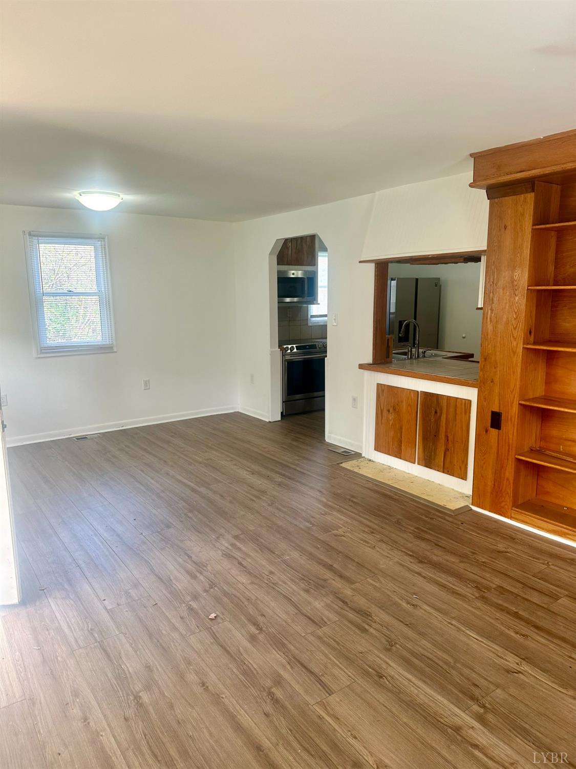 476 Kenmore Road Amherst, VA 24521 - Photo 3 of 32 a view of a living room with furniture and wooden floor