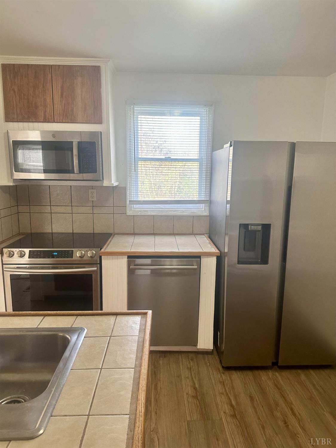 476 Kenmore Road Amherst, VA 24521 - Photo 8 of 32 a kitchen with a stove and a refrigerator
