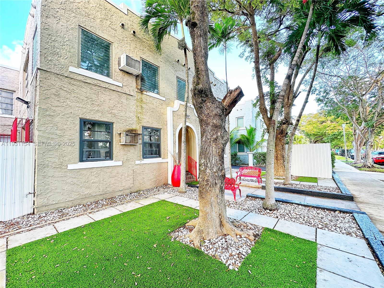 2153 Southwest 14th Terrace, Unit 1 Miami, FL 33145 - Photo 2 of 17 a front view of a house with garden