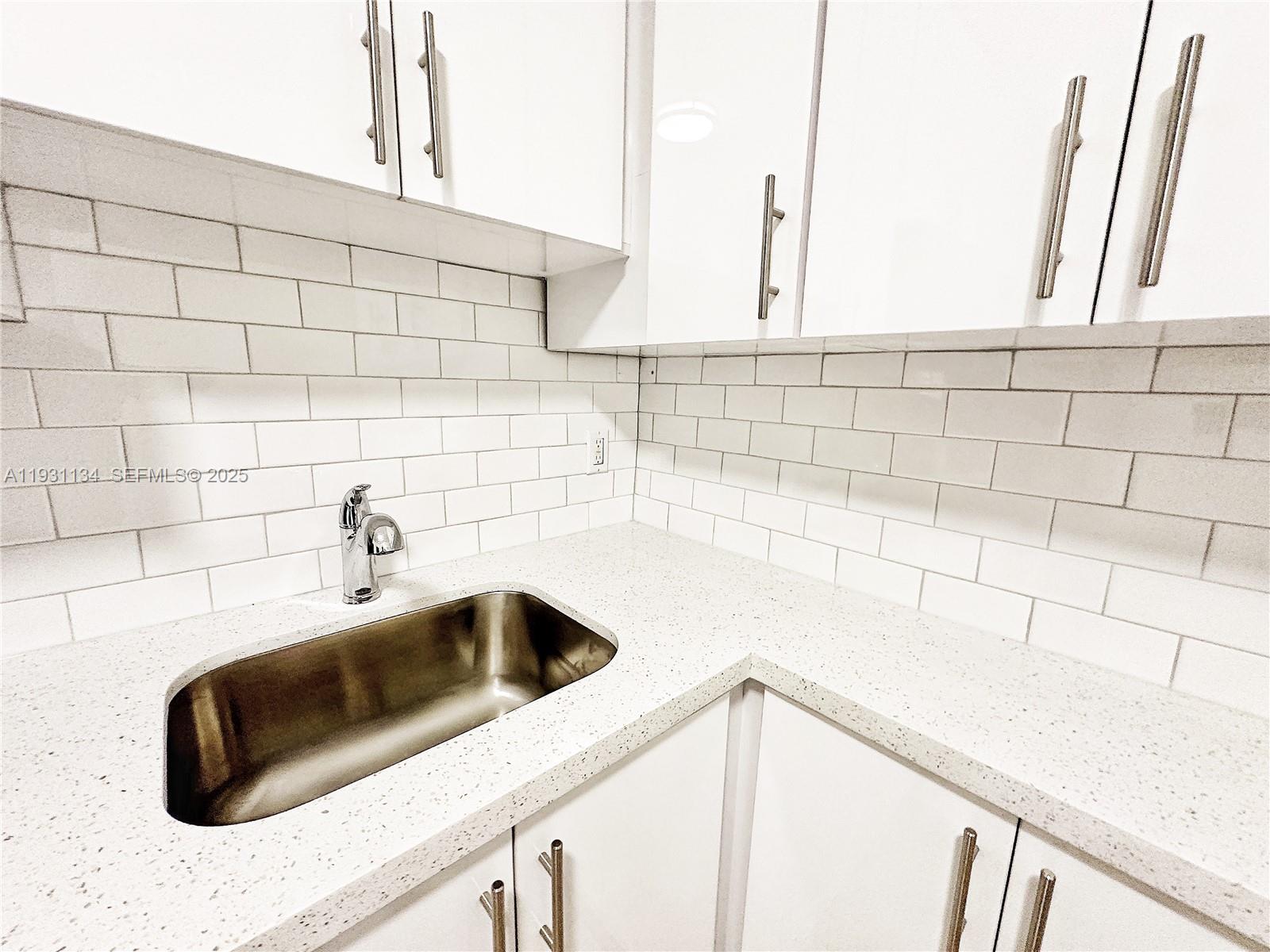 2153 Southwest 14th Terrace, Unit 1 Miami, FL 33145 - Photo 5 of 17 a bathroom with a sink and a bathtub