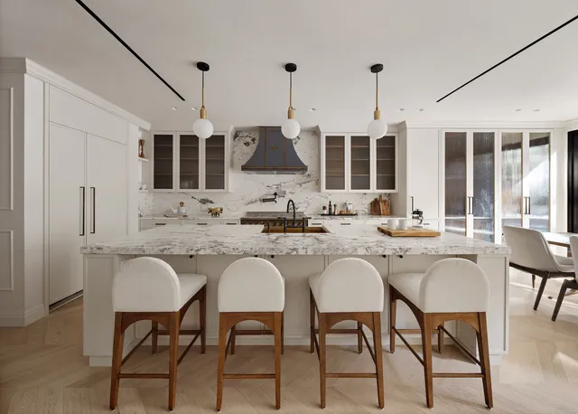 a kitchen with a sink chairs and white cabinets