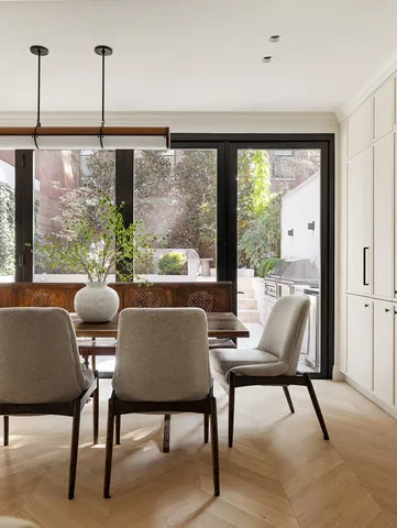 a large kitchen with kitchen island a large counter space a sink appliances and cabinets