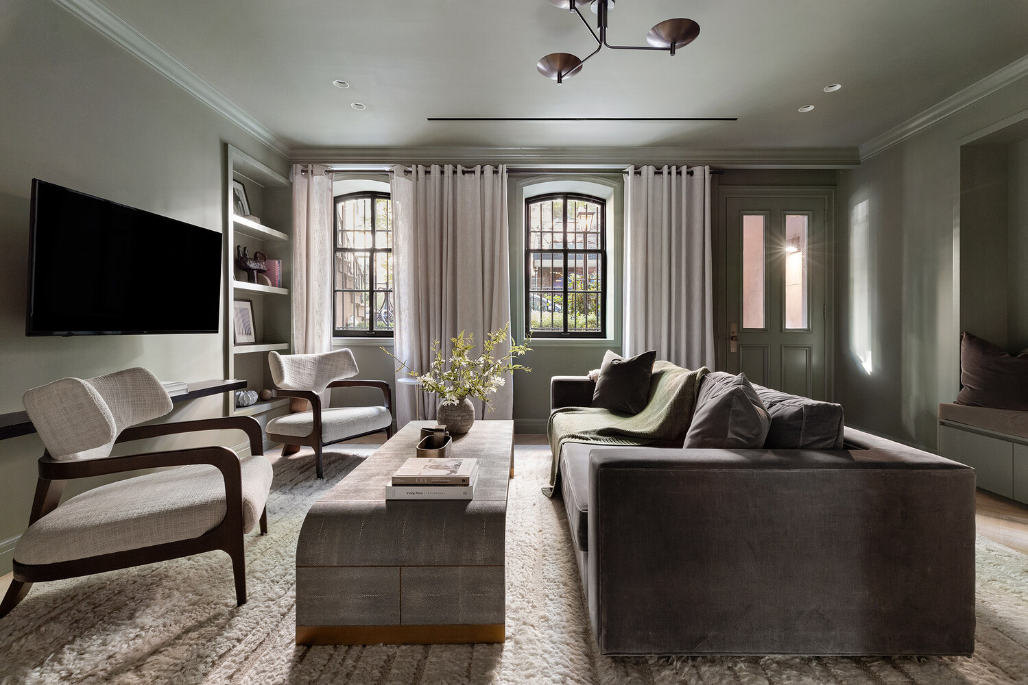 34 West 12th Street Manhattan, NY 10011 - Photo 22 of 53 a living room with furniture and a flat screen tv