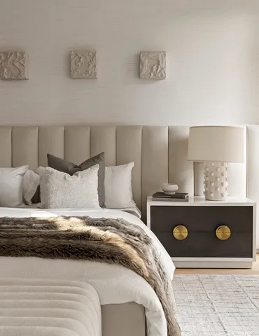 a bedroom with a bed and a couch